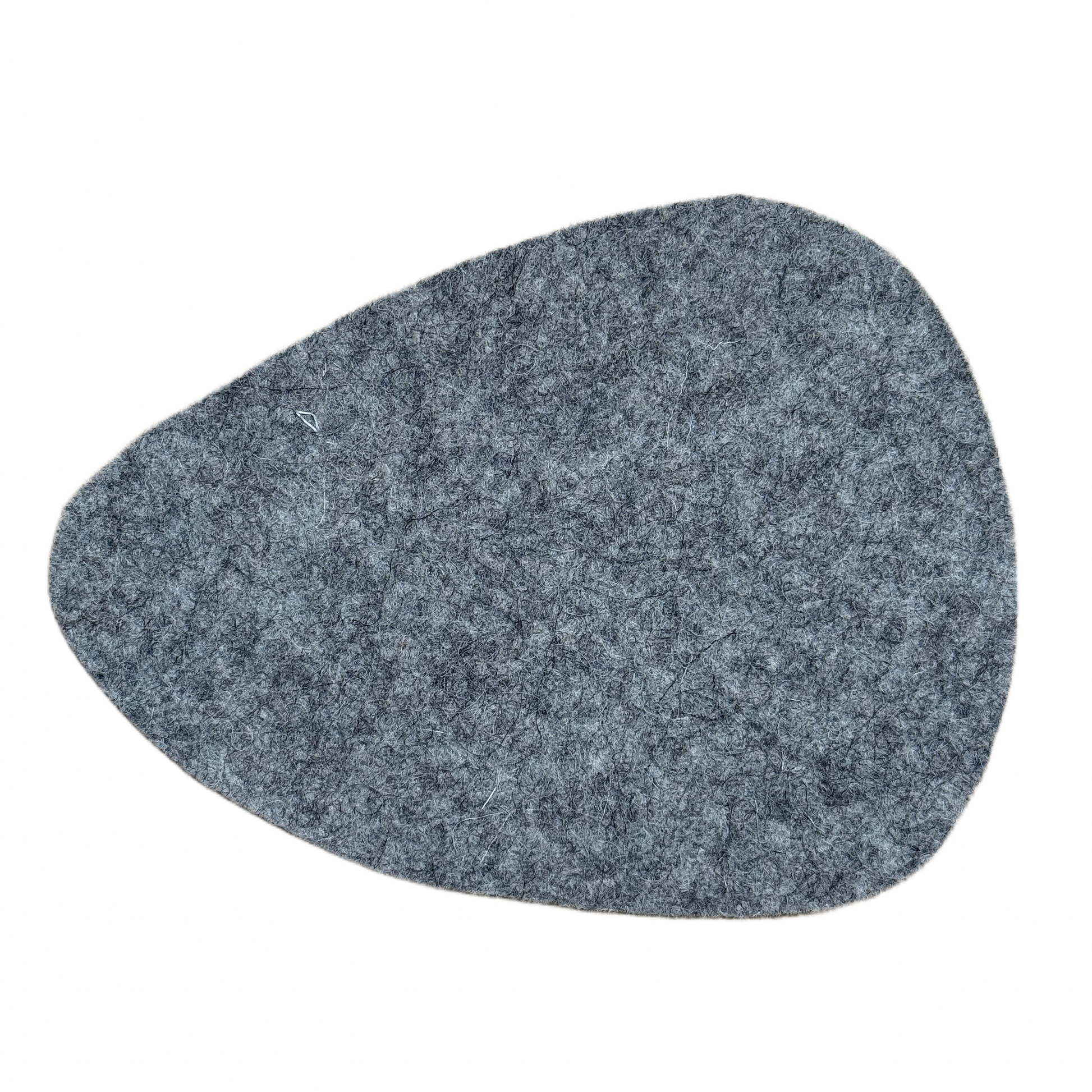 Stone-shaped coaster made from 100% natural wool, in neutral tone - back view